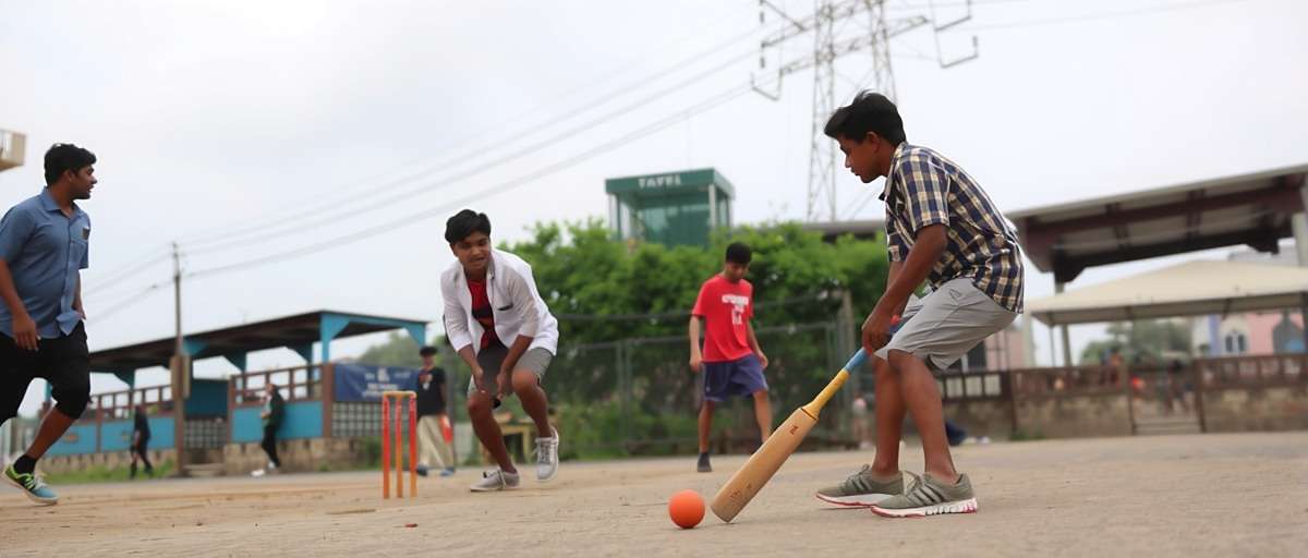 Ameerpet Aces Gully Cricket Ameerpet Aces gully cricket mode showing street match with boys in casual clothes